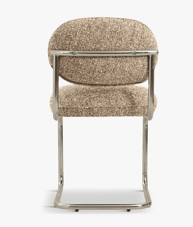 A modern accent chair featuring a cantilever base and upholstered seat and back. The frame is constructed from polished tubular metal, forming a cantilevered structure that supports the seat and backrest. The seat and backrest are generously padded and upholstered in a textured, speckled fabric. — 3D model