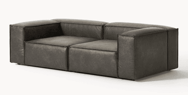 A dark grey modular sectional sofa, upholstered in distressed faux leather, featuring a low profile and rounded, plush cushions, seen from the rear and side. — 3D model