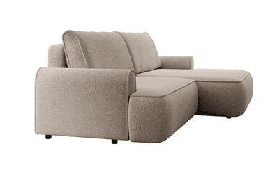 A sectional sofa with a chaise lounge. The sofa features a textured boucle fabric upholstery in a neutral beige tone. It has a low-profile design with padded armrests and back cushions. The construction appears to be modular, with distinct seating sections and a chaise extension. — 3D model