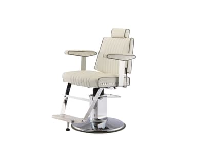 A white barber chair with channel tufting on the seat back and seat. It features chrome accents on the armrests, base, footrest, and hydraulic lift mechanism. The chair includes a headrest and a flip-up footrest. There is a logo on the side of the seat that reads 'BELMONT'. — 3D model