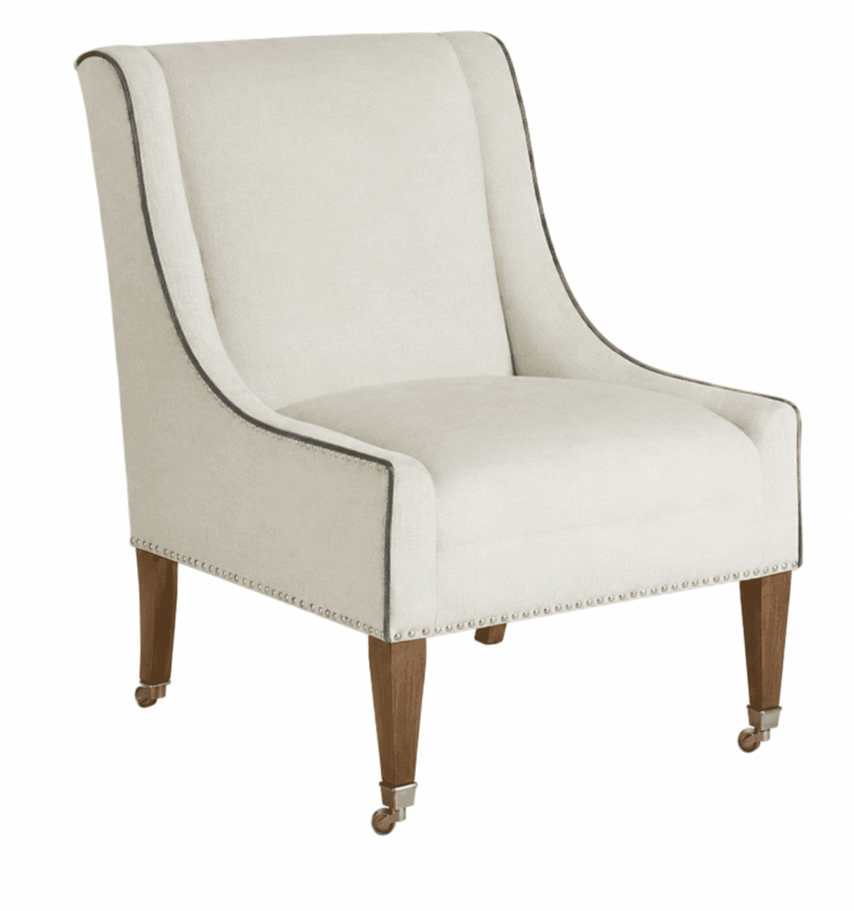 An upholstered armchair featuring a light-colored fabric, dark piping details, and decorative nailhead trim. It has tapered wooden legs, with the front two equipped with brass casters. — 3D model