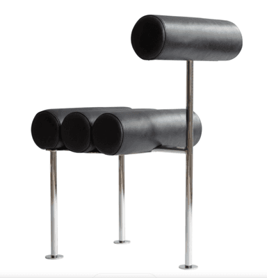 A postmodern chair featuring cylindrical bolster cushions for the seat and backrest, supported by a sleek, polished tubular metal frame. The upholstery is black, creating a striking contrast with the metallic frame. — 3D model