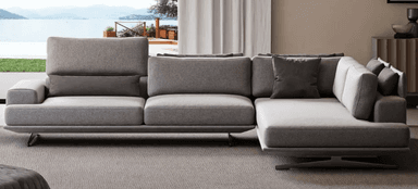 A modern, sectional sofa with a light grey fabric upholstery and dark grey accent pillows. The sofa features a low-profile design with thin, angled metal legs, and adjustable headrests on some sections. It is configured in an L-shape. — 3D model