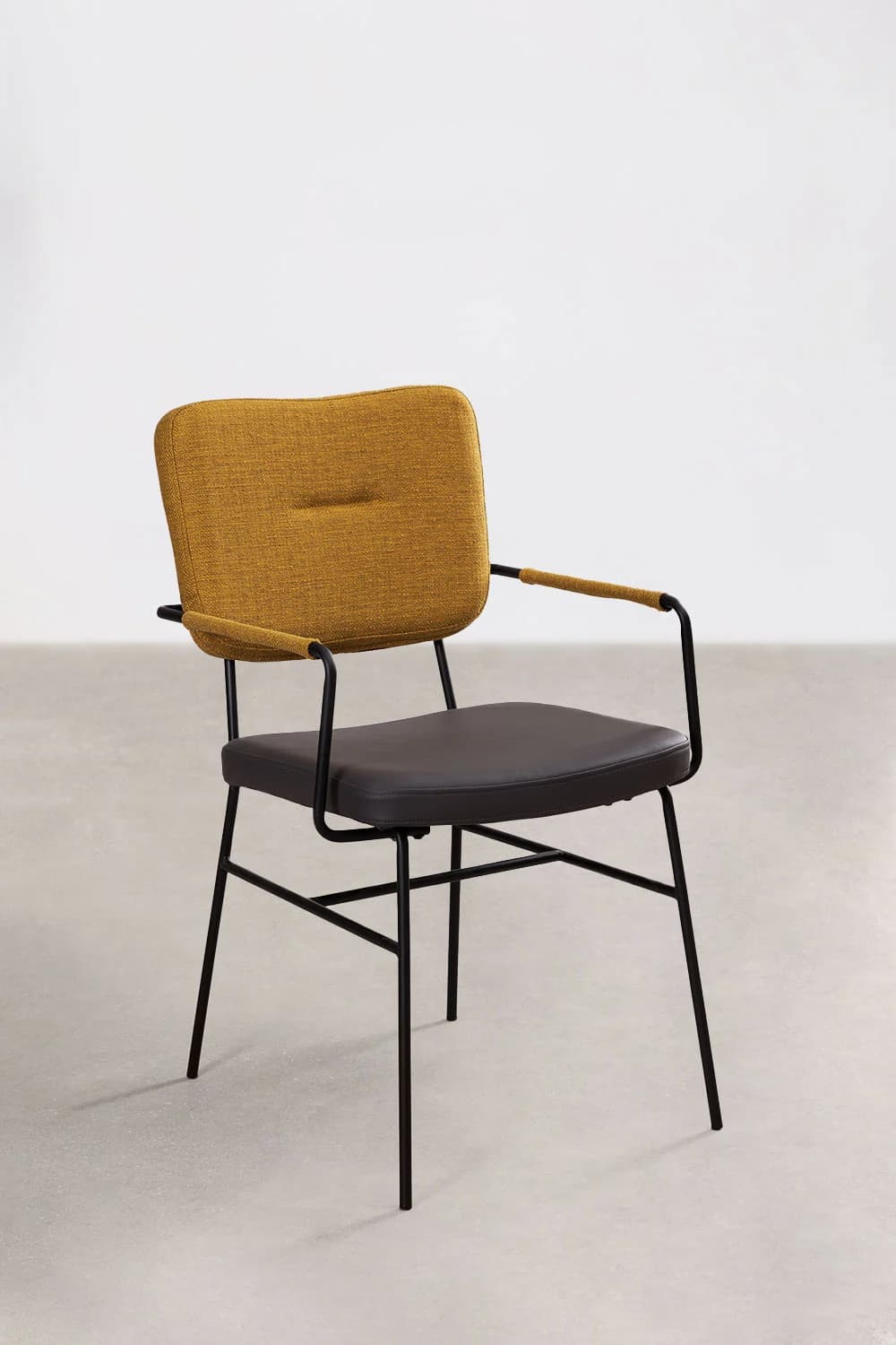 A modern armchair with a dark upholstered seat and a textured yellow fabric upholstered backrest. It features a slender black metal frame for the legs and arms. The arms are angled and extend from the backrest support to just before the seat. The backrest has a subtle horizontal seam and a tufted detail. — 3D model