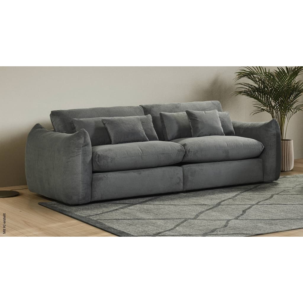 A modern three-seater sofa upholstered in textured grey fabric, featuring deep seat cushions, plush backrests, and four matching accent pillows. — 3D model