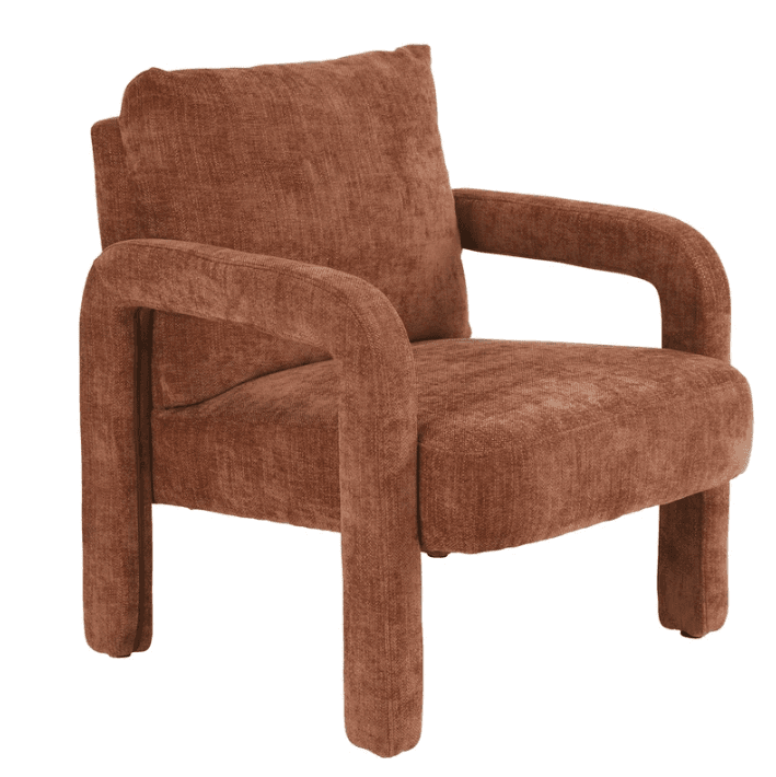 A contemporary upholstered armchair featuring integrated arms and legs, covered in a textured rust-brown fabric. It has a single, loose back cushion and a deep, comfortable seat. The design is characterized by its continuous, chunky upholstered form, giving it a soft, monolithic appearance. — 3D model