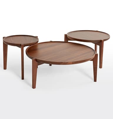 A round, dark wooden coffee table featuring a distinctive tray-like top with a raised edge. The table stands on four tapered legs, giving it a modern and minimalist aesthetic. The wood has a smooth, rich dark brown finish. — 3D model