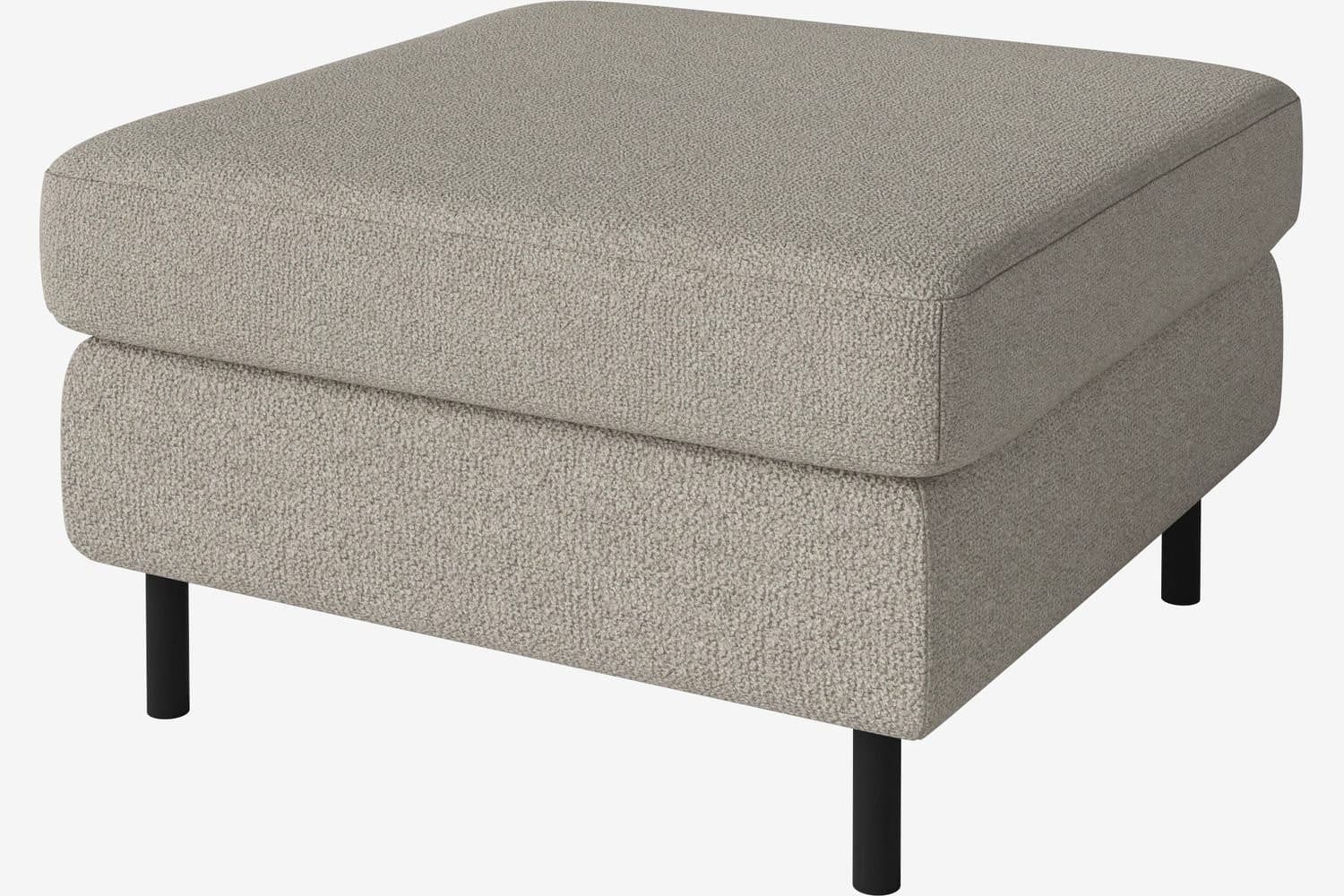 A rectangular ottoman with a plush, upholstered top and a slightly recessed base, supported by four slender, dark-colored legs. The upholstery has a textured, woven appearance. — 3D model