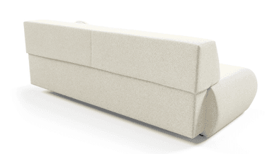 A modern, low-profile sofa with a minimalist design. It features a seamless, upholstered frame with rounded edges, a slightly angled backrest, and a single long seat cushion. A small, round throw pillow is placed on the right side of the backrest. The upholstery has a textured appearance. — 3D model