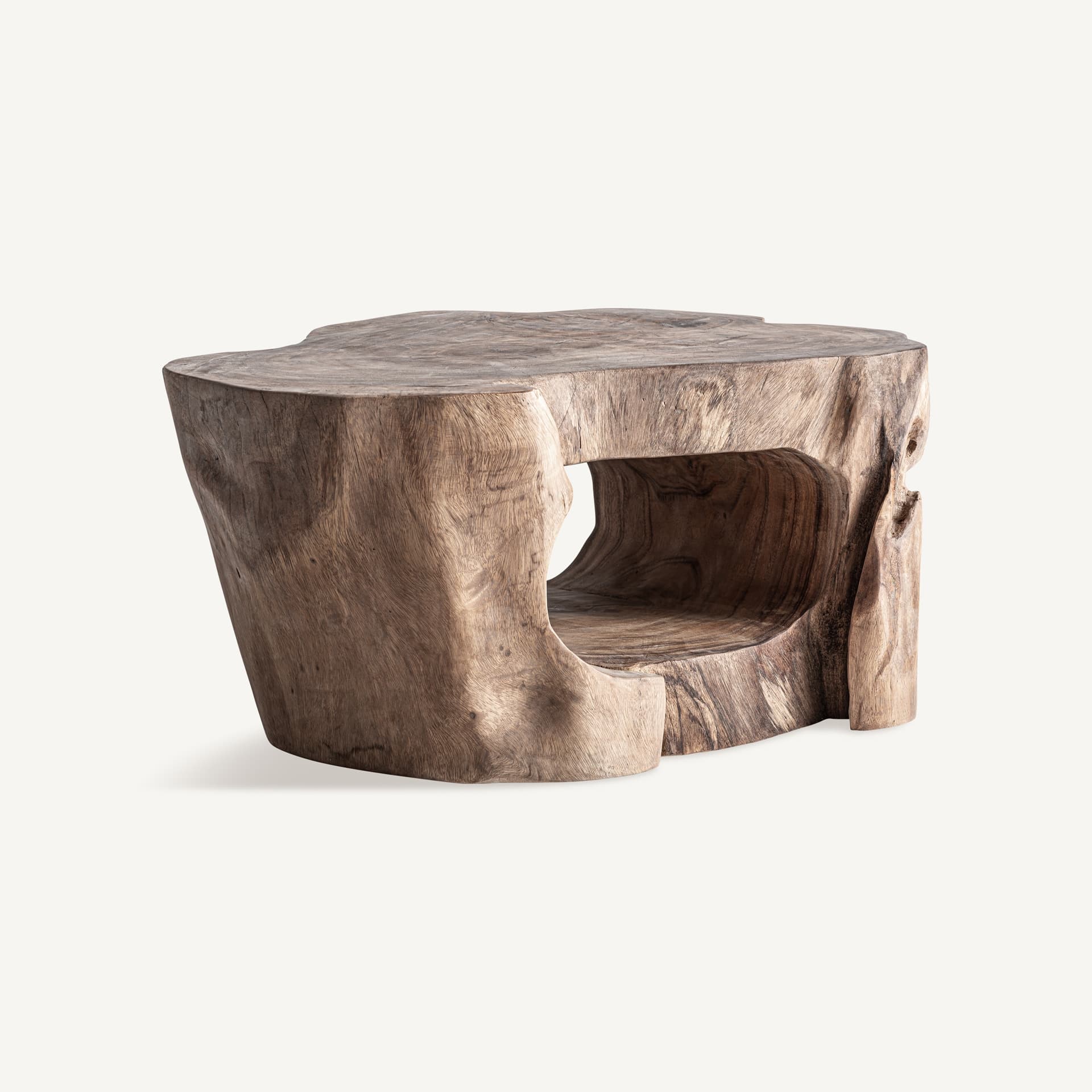 A rustic end table carved from a single piece of wood, resembling a tree stump. It features an irregularly shaped top surface and a hollowed-out interior with an opening on one side, creating a natural cavity. The exterior showcases the wood grain and natural contours of the material. — 3D model