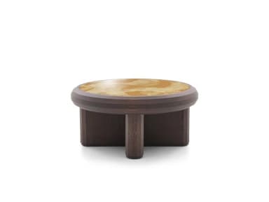 A low-profile round coffee table featuring a dark stained wooden frame and a distinctive light-colored, patterned inlay top. The table's base consists of thick, rounded and rectilinear elements, giving it a robust and grounded appearance. The top surface is circular with a subtly textured or metallic-look pattern, set within a thick, rounded wooden rim that matches the base. — 3D model