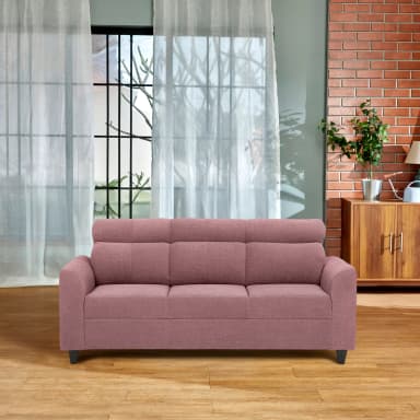 A modern three-seater sofa upholstered in a dusty pink or mauve fabric, featuring a clean, rectilinear silhouette. The sofa includes three distinct seat cushions and three back cushions, with integrated, adjustable cylindrical headrests extending from the top of the backrests. It has wide, squared-off block arms and is supported by short, tapered black legs. — 3D model