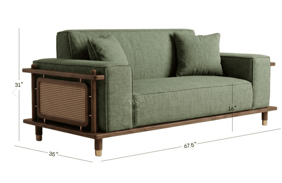 A two-seater sofa featuring a robust dark wooden frame with integrated armrests that include decorative cane webbing panels. The sofa is upholstered in a muted green fabric with plump seat, back, and throw cushions. It stands on short, tapered wooden legs capped with brass accents. — 3D model