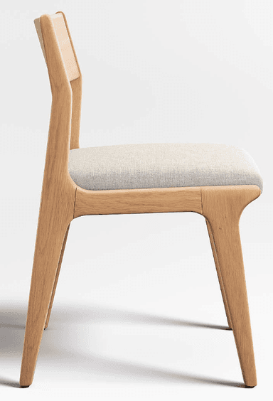 This is a modern dining chair crafted from light-colored wood, likely oak or ash, featuring a minimalist design. The chair has a gently curved backrest that is integrated into the frame and a square, upholstered seat in a light beige or off-white fabric. The legs are straight and slightly tapered, extending from the seat frame. The overall aesthetic is clean and contemporary. — 3D model