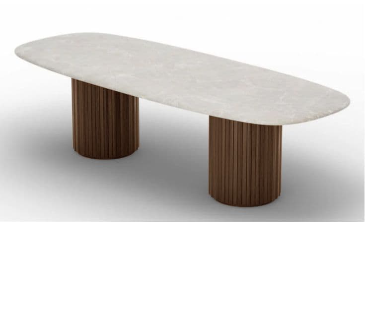 A contemporary dining table featuring an oval, light-colored marble top resting on two cylindrical, fluted wooden pedestal bases. — 3D model