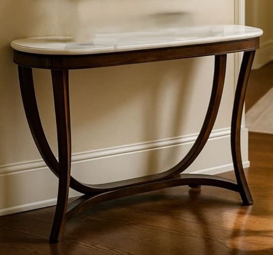 An elegant modern console table featuring an elongated oval white marble top and a dark wood sculptural base with curved supports. — 3D model