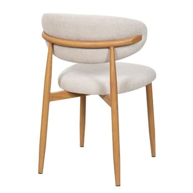 A contemporary armless chair featuring a light beige/cream upholstered seat and a gently curved backrest. It sits on four slender, tapered wooden legs, providing a warm, natural contrast to the neutral upholstery. The design is minimalist and functional, indicative of Scandinavian aesthetics. — 3D model