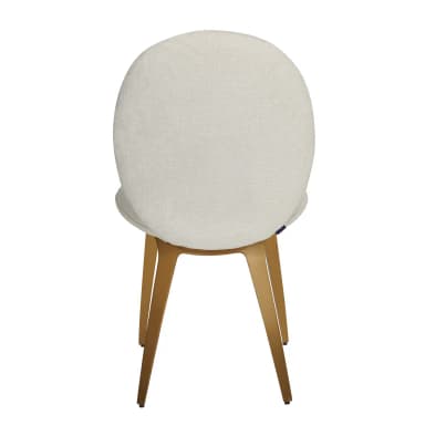 A contemporary accent chair featuring a rounded, upholstered back and seat in cream bouclé fabric, supported by splayed gold-tone metal legs. — 3D model
