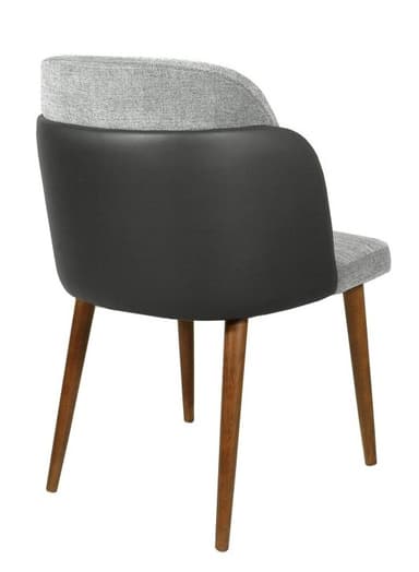 A modern chair with a fabric upholstered seat and back, and dark side panels. It features four tapered wooden legs. — 3D model