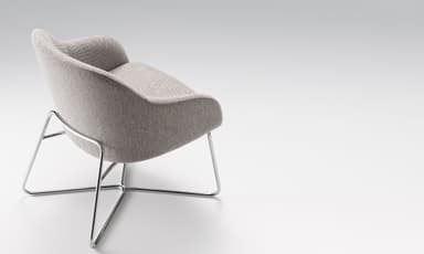 A modern upholstered lounge armchair featuring a curved gray fabric shell with integrated arms and a separate seat cushion, supported by a minimalist black metal sled base. — 3D model