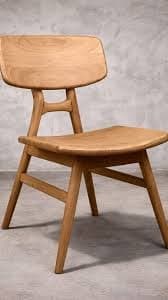 A minimalist wooden chair with a slightly curved seat and backrest, supported by four tapered legs connected by stretchers. The design emphasizes natural wood grain and organic curves. — 3D model