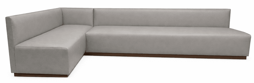 A modern sectional sofa with a low profile and clean lines. The sofa features a light-colored, upholstered seat and back, with a distinct L-shaped configuration. It is supported by a dark, thin base that extends slightly beyond the upholstered portion. — 3D model