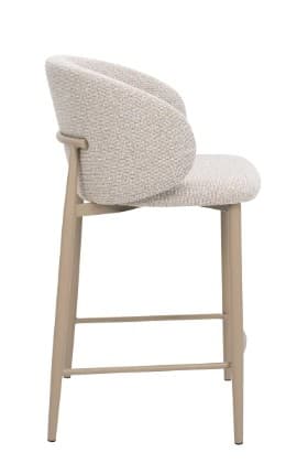 A contemporary bar stool featuring a fully upholstered seat and backrest, supported by slender metal legs. The backrest is rounded and partially wraps around the sides, offering a bucket-like seating experience. A horizontal footrest connects the front legs, while a rear stretcher connects the back legs, providing stability. — 3D model