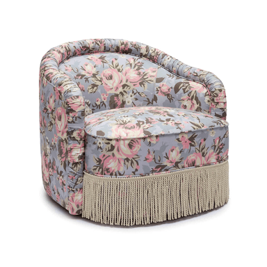 A small, fully upholstered barrel-back accent chair featuring a vibrant floral pattern and a decorative fringe skirt along its base. — 3D model