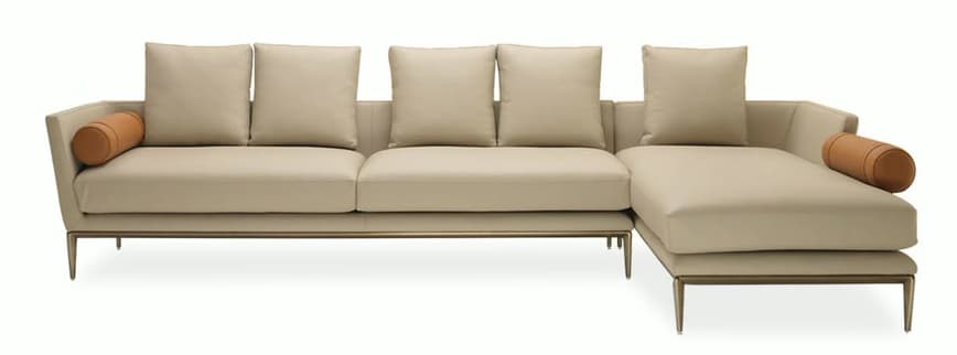 A modern L-shaped sectional sofa featuring a chaise lounge on the right, upholstered in smooth beige leather. It has a low-profile design with thin arms and an exposed metal frame base with slender legs. Two cylindrical bolster pillows, upholstered in a contrasting tan leather, are positioned on each armrest. — 3D model