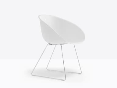 A white molded shell lounge chair with a minimalist chrome-plated wire sled base. — 3D model