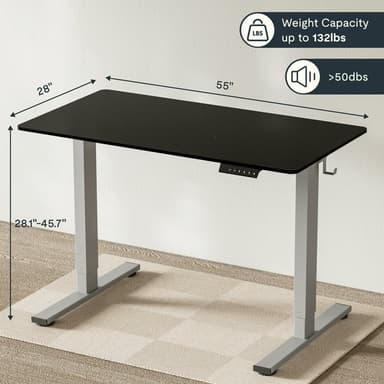 An electric adjustable-height standing desk featuring a rectangular black tabletop supported by two silver metal T-shaped legs. A control panel with height adjustment buttons and memory presets is visible on the underside of the tabletop. — 3D model