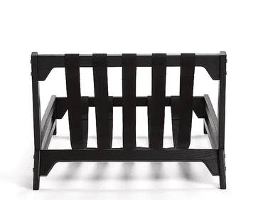 A modern, low-slung lounge chair frame constructed from black-stained wood with exposed black textile webbing for the seat and back support. The design features clean lines and visible brass pin fasteners. — 3D model