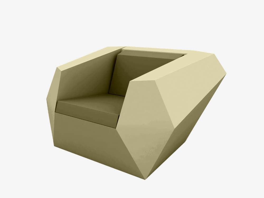 A modern, angular armchair with a faceted geometric design. The armchair features a low profile and a deep, integrated seat and back cushion. The exterior structure has sharp edges and flat planes, resembling a crystalline form. The color is a uniform matte shade. — 3D model