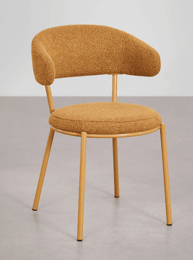 A modern accent chair with a rounded backrest that extends into armrests. The seat and backrest are upholstered in a textured, boucle-like fabric. The chair is supported by four slender, tapered metal legs finished in a mustard yellow color. — 3D model