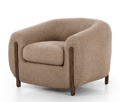 A contemporary, fully upholstered lounge chair with a rounded, organic form, covered in a textured, light beige boucle fabric and supported by short, dark cylindrical wooden legs. — 3D model