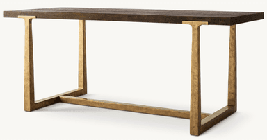 A console table featuring a dark stained wooden top with a pronounced grain texture and a rough-hewn appearance. The base is constructed from metal with a distressed, antique brass-like finish, exhibiting a textured, hammered surface. The legs are elongated and rectangular, connected by a lower horizontal stretcher, creating a minimalist yet robust structure. — 3D model