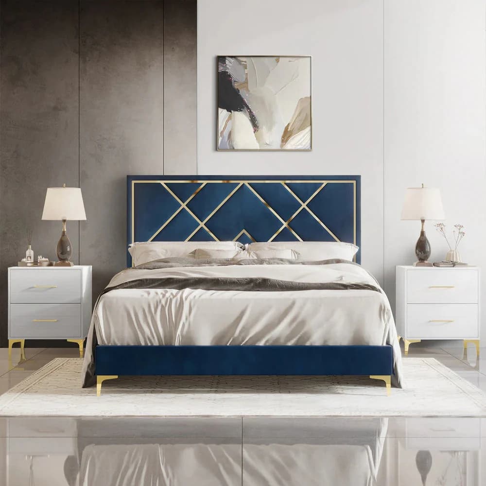 An elegant platform bed featuring a rich blue velvet upholstery across its frame and headboard. The headboard is adorned with a striking gold-finished metal overlay forming an intricate geometric, Art Deco-inspired pattern. The bed is supported by slender, tapered gold-finished legs, complementing the headboard accents. It includes white bedding, suggesting a complete bed setup. — 3D model