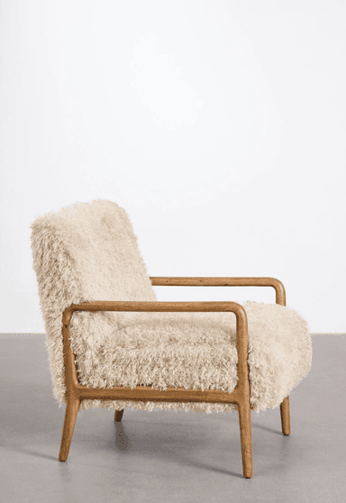 A cream-colored armchair with a textured, fluffy upholstery. The frame and armrests are made of polished wood, featuring a minimalist design with gently curved lines. The chair rests on four wooden legs. — 3D model