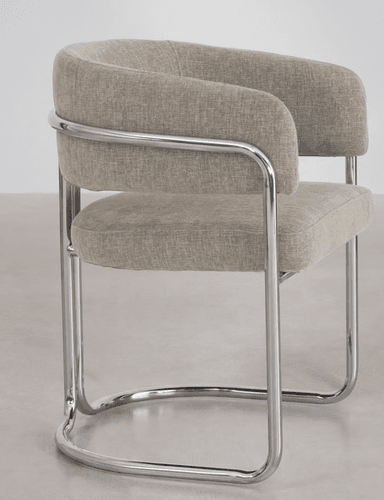 A modern armchair with a tubular chrome frame and upholstered seat and back. The frame consists of bent chrome tubes forming the legs, armrests, and supporting structure for the upholstery. The seat and backrest are upholstered in a textured, neutral-toned fabric. — 3D model