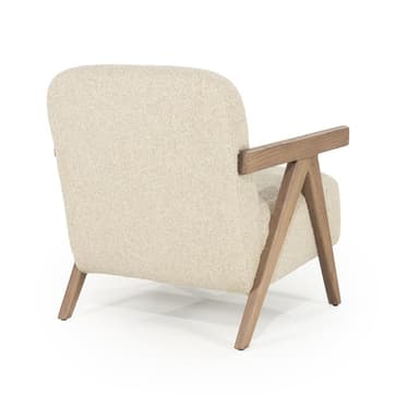 A modern armchair with a rounded backrest and seat, featuring wooden armrests and legs. The upholstery appears to be a textured, light-colored fabric. The wooden frame has a visible grain and a natural finish. The design incorporates angled wooden supports for the armrests and legs, giving it a distinctive silhouette. — 3D model