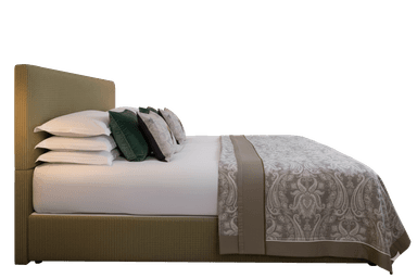 A side profile view of a bed with a fabric-covered headboard and frame. The bed is made with white sheets, layered pillows (some decorative with dark green and patterned covers), and a decorative throw blanket with a damask pattern in neutral tones. The frame and headboard appear to be upholstered with a ribbed fabric. — 3D model