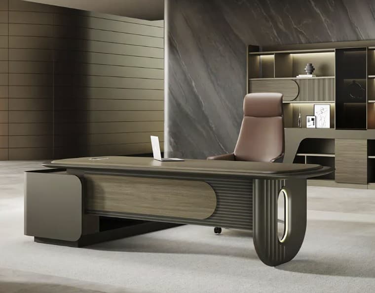 A modern executive desk with a sleek, elongated elliptical tabletop. The desk features a substantial base with integrated storage elements. One side has a rounded, metallic accent, while the other incorporates fluted detailing and an oval illuminated accent. The surface appears to be a wood-grain laminate, complemented by matte grey and metallic finishes. — 3D model
