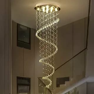A luxurious modern chandelier featuring a gold-finished ceiling mount from which multiple strands of clear crystals and larger frosted spherical beads descend. The design incorporates a distinct spiral formation of illuminated spheres, creating a cascading and opulent effect suitable for grand interiors. — 3D model