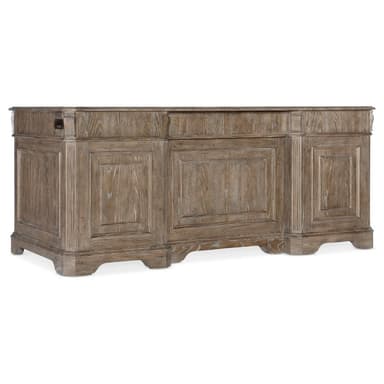 A large, traditional double pedestal executive desk crafted from wood with a weathered finish, featuring multiple drawers and antique brass hardware. — 3D model