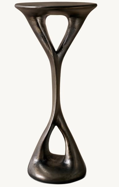 A small, dark-finished sculptural table featuring a round top and base connected by an organically twisted central support, crafted from cast metal. — 3D model