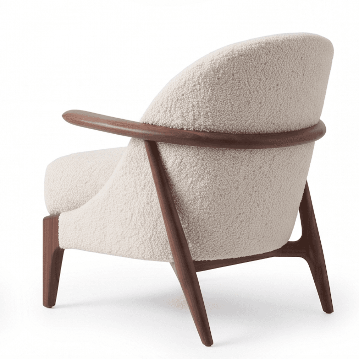 A contemporary armchair featuring an exposed dark wood frame with a curved backrest and integrated armrests. The seat and back are generously upholstered in a cream or off-white boucle fabric, providing a textured and plush appearance. The legs are tapered and splayed, contributing to an elegant and lightweight silhouette. — 3D model