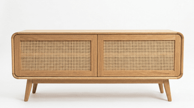A contemporary, low-profile storage cabinet crafted from light-colored oak wood, featuring smoothly rounded corners on the top, sides, and front panel. It stands on four splayed and tapered legs, presenting a minimalist design with a single large front panel that likely functions as a door for enclosed storage. — 3D model