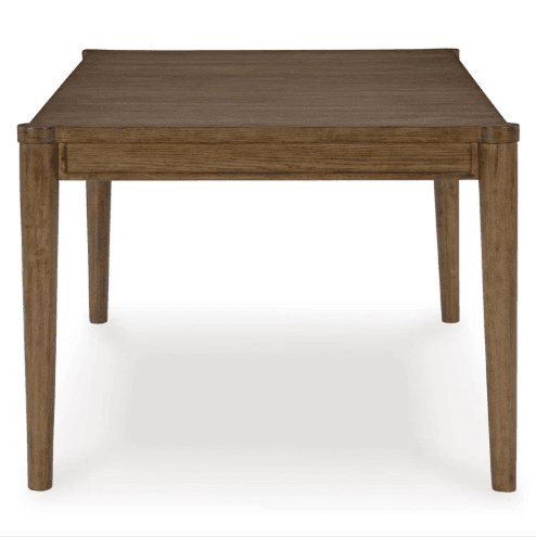 A rectangular dining table crafted from solid wood or wood veneer, featuring a medium brown finish that highlights the natural grain. It stands on four outwardly splayed, tapered legs, supporting a substantial tabletop with subtly rounded corners and a minimalist apron. — 3D model