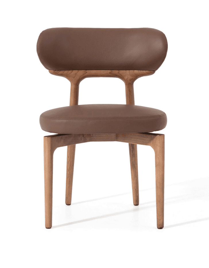 A contemporary chair with a wooden frame and upholstered seat and backrest. The frame has a natural wood finish with visible grain. The seat and backrest are upholstered in brown leather, featuring a smooth texture and rounded edges. — 3D model