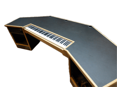 A purpose-built music studio production desk featuring a multi-faceted dark gray work surface with light wood trim. It includes an integrated keyboard tray and rack-mount bays for audio equipment. The desk has an angled design to optimize workflow and provides space for studio monitors and other gear. — 3D model